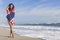 Young Woman Girl in American Flag on Beach
