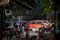 Young woman, girl, checking her smartphone telephone sitting on the terrace of a cafe and restaurant of downtown belgrade