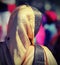 Young woman with golden veil during a religious event