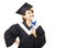 young woman graduating holding diploma and looking