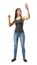 Young woman in gray top and blue jeans standing, one hand in `pinch` gesture and other raised as if touching invisible