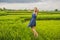 Young woman on Green cascade rice field plantation. Bali, Indonesia