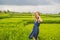 Young woman on Green cascade rice field plantation. Bali, Indonesia