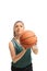 Young woman in a green jersey with a basketball preparing to shoot isolated on white background