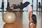 Young woman with gym ball at gymnasium