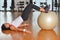 Young woman with gym ball at gymnasium