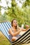 Young woman on hammock making a selfie