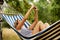 Young woman on hammock making a selfie