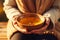 Young woman hands holding aromatic teacup cup of green leaves tea hot steaming beverage morning comfy comfortable