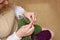 Young woman hands knitting with two coloured wool