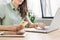 Young woman hands using laptop and smartphone in office. Beautiful girl texting on phone.