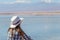 Young woman in hat admiring american landscape of untouched nature with unique landscape with copy space