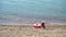 Young woman in hat on the beach vacation