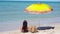 Young woman in hat on the beach vacation