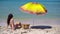 Young woman in hat on the beach vacation