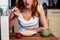 Young woman having cereal and fruit for breakfast