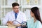 Young woman having a consult with doctor.