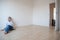 Young woman having a drink in her brand new modern apartment