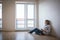 Young woman having a drink in her brand new modern apartment