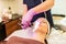 Young woman having face microdermabrasion at spa