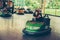 Young woman having fun in electric bumper car