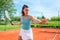 Young woman having outdoor tennis practice