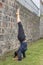 Young woman headstand in yoga salamba sirsasana position outdoors