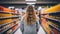 Young Woman healthy Shopping in the Juice Aisle in supermarket, beverage variety