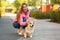 Young woman with her adorable Pembroke Welsh Corgi dog