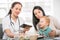 Young woman and her child at the doctor homeopaths