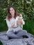 Young woman with her cute Jack Russell Terrier outdoor