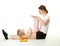 Young woman and her daughter doing sport exercises