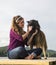 Young Woman with her Dog on a Dock