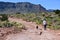 Young woman with her dog at Toroweap in the Grand Canyon.