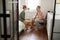 Young woman and her husband interacting in bedroom