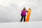 Young woman and her orange snowboard