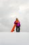 Young woman and her orange snowboard