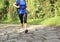 Young woman hiker feet walking rural trail