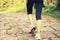 Young woman hiker feet walking rural trail