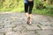 Young woman hiker feet walking rural trail