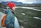 Young woman hiker hiking in beautiful mountains in Thingvellir valley