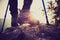 Young woman hiker legs climbing at mountain peak