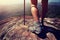 Young woman hiker legs on mountain peak