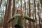 Young woman hiker relaxing in the woods