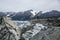 Young woman hiking across the Berendon Glacier in British Columbia