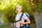 Young woman hiking in countryside. Backpacking hike