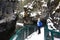 Young woman hiking in Johnston Canyon in winter.