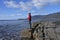 Young woman hiking over the Tessellated Pavement in Tasman Peninsula Tasmania Australia