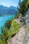 Young woman at hiking trail along lake achensee