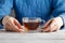 Young woman hold glass cup oÐ° tea on table